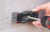 A hand is holding a kwb DrillBlock jig and using a drill to make a hole in a tiled wall. Anteprima dell’immagine prodotto