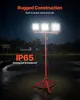 A portable LED work light with a tripod stand is shown in the rain at night. Podgląd zdjęcia produktu