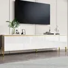 A modern white TV cabinet with gold accents and legs, featuring a large black television mounted above it. Anteprima dell’immagine prodotto