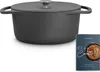A gray cast iron Dutch oven with a lid and a cookbook are displayed on a white background. Produktbild-Vorschau