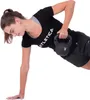 A woman is performing a workout with a kettlebell. Produktbild-Vorschau