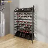 A black metal wine rack filled with wine bottles, placed against a textured wall and next to a staircase. Náhľad obrázku produktu