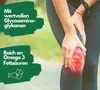 A person is holding their knee, which is highlighted with a red and yellow glow, suggesting pain or inflammation. Text overlays provide information about the product's benefits. Podgląd zdjęcia produktu