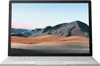 A silver laptop with a landscape wallpaper on its screen. Produktbild-Vorschau