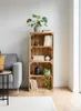 A living room setting with a sofa, a side table, and a wooden crate shelf unit. Anteprima dell’immagine prodotto