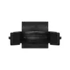 A close-up, front-facing view of a black plastic furniture foot clip. Voir les images du produit