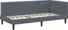 A dark gray upholstered bed frame with a slatted base and a channel-tufted headboard, shown from a side angle against a white background. Produktbild-Vorschau