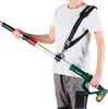 A person is holding a telescopic hedge trimmer with a shoulder strap. Produktbild-Vorschau