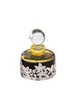 A perfume oil bottle with a decorative silver base. Voir les images du produit