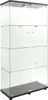 A freestanding glass display cabinet with a black base and top. Podgląd zdjęcia produktu