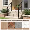 A black metal handrail installed on outdoor stairs made of light-colored stone or wood, with decorative planters and a lantern visible. Voir les images du produit