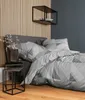 A bedroom scene with a bed, side tables, and wall decor. Produktbild-Vorschau