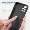 A hand is touching the matte surface of a black phone case, with cotton balls in the background. Produktbild-Vorschau