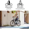 A woman riding an electric bicycle on a cobblestone street. Produktbild-Vorschau