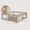 A beige playpen with orange accents and cutouts shaped like bear ears, shown with two of its mesh flaps open. Produktbild-Vorschau