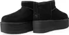 A pair of black UGG platform boots. Voir les images du produit