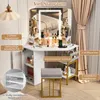 A corner vanity table with a lighted mirror, stool, and various makeup products displayed. Produktbild-Vorschau