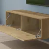 A close-up view of a wooden media console with its doors open, revealing internal compartments and gas struts for soft-close functionality. Produktbild-Vorschau