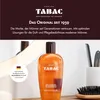 A bottle of Tabac Original Shower Gel is displayed on a shelf with grooming accessories. Podgląd zdjęcia produktu