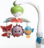 A baby mobile with animal toys attached to a curved arm. Voir les images du produit