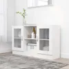 A white sideboard cabinet with glass doors is shown in a room with a gray rug and a mirror on the wall. Produktbild-Vorschau