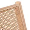 A close-up view of the rattan weave and wooden frame of a chair. Náhľad obrázku produktu