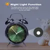 A vintage alarm clock with a green dial is shown, with a graphic overlay explaining its night light function. Voir les images du produit