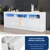 A white TV cabinet with LED lighting and two drawers, shown in a living room setting. A close-up of a drawer mechanism is also shown. Produktbild-Vorschau