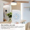 A ceiling fan with a light fixture and a remote control is shown in a modern interior setting. Podgląd zdjęcia produktu