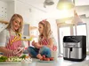 A mother and daughter are in a kitchen preparing food. An air fryer is visible on the counter. Voir les images du produit