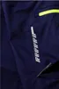 A close-up of dark blue work pants with neon yellow accents and a reflective stripe. Produktbild-Vorschau