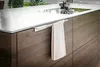 A close-up view of a modern kitchen counter with a towel hanging from a handle. Produktbild-Vorschau