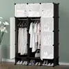 A modular wardrobe with clothes hanging inside and shoes on the bottom shelf. Podgląd zdjęcia produktu