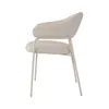 A side view of a modern armchair with fabric upholstery and metal legs. Podgląd zdjęcia produktu