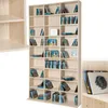 A light wood CD/DVD shelf unit filled with CDs and DVDs. Produktbild-Vorschau