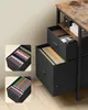 Close-up view of a black filing cabinet with a rustic wood-topped desk. Náhled obrázku produktu