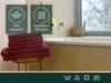 A stack of burgundy towels is placed on a stool next to a bathtub. The image also includes informational graphics about the towels. Produktbild-Vorschau