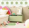 A child's bedroom with a toy chest, bed, and decorative items. Voir les images du produit