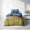 A bedding set with a tractor print is displayed on a bed in a room. Produktbild-Vorschau