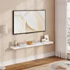 A white floating shelf mounted on a light beige wall, displaying a television, books, and decorative items. Produktbild-Vorschau