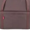 A close-up view of a brown fabric bag with a pink tag. Produktbild-Vorschau