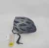 A gray Uvex bicycle helmet with a tag attached. Produktbild-Vorschau