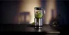 A blender with green contents sits on a dark countertop, with a blurred background. Voir les images du produit