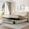 A beige upholstered bed with its storage compartments open, showcasing its functionality. Produktbild-Vorschau