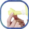 A human hand is holding a small yellow plush toy arm. Anteprima dell’immagine prodotto