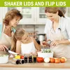 Three people, a grandmother, mother, and daughter, are in a kitchen preparing food. The focus is on the spice jars and other ingredients on the counter. Produktbild-Vorschau