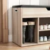 A shoe cabinet with storage and a seating area, showing boots and shoes on shelves. Podgląd zdjęcia produktu