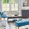 A living room scene with a blue armchair, coffee table, and bench. Anteprima dell’immagine prodotto