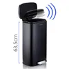 A black stainless steel trash can with its lid open, showing a motion sensor graphic above it. A height measurement is indicated on the left side. Produktbild-Vorschau