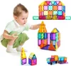 A young child is playing with magnetic building blocks, constructing various structures. Náhled obrázku produktu